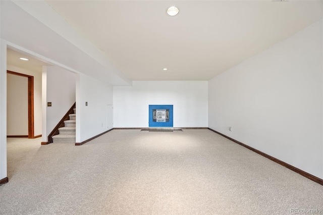 6207 Elbert Pl, Parker, CO 80134 - unfurnished living room featuring carpet floors, stairway, recessed lighting, and a fireplace