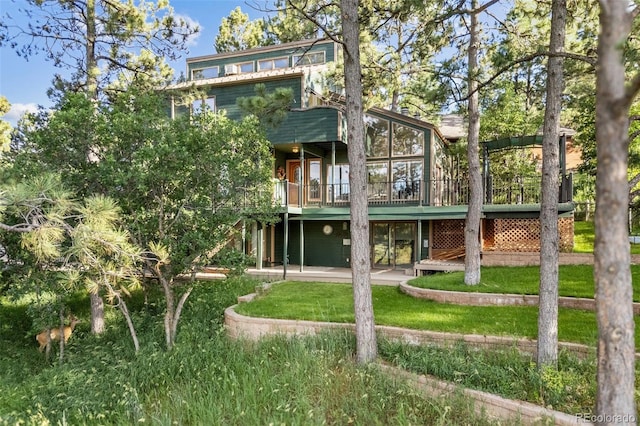 6207 Elbert Pl, Parker, CO 80134 - back of house with a wooden deck and a yard
