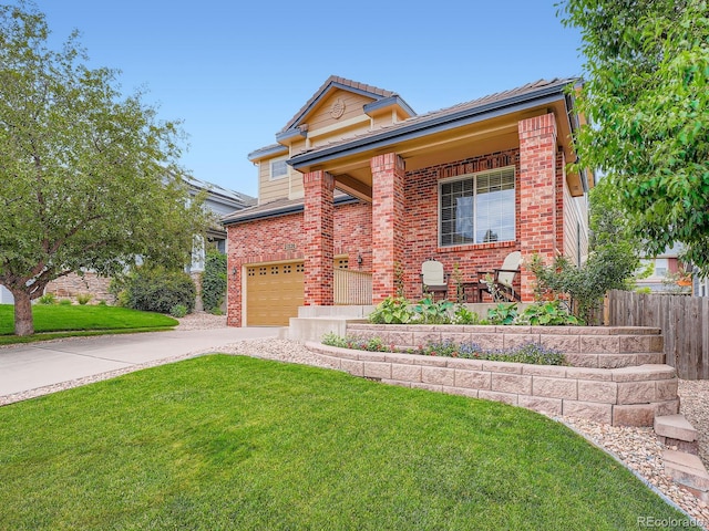 21220 E Nassau Ave, Aurora, CO 80013 - view of front of property featuring driveway, brick siding, and covered porch