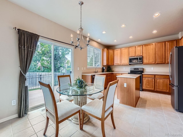 21220 E Nassau Ave, Aurora, CO 80013 - dining room featuring a chandelier, recessed lighting, and light tile patterned floors