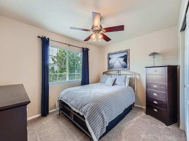 21220 E Nassau Ave, Aurora, CO 80013 - bedroom featuring light colored carpet and a ceiling fan
