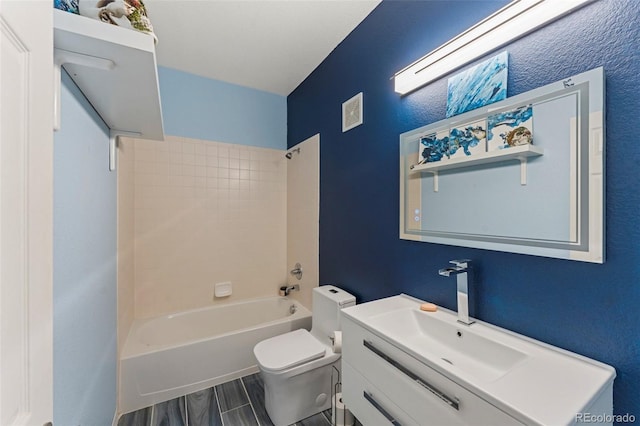 full bathroom with tiled shower / bath combo, vanity, and toilet