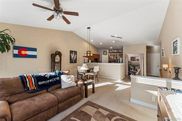 living room featuring light carpet, vaulted ceiling, and ceiling fan