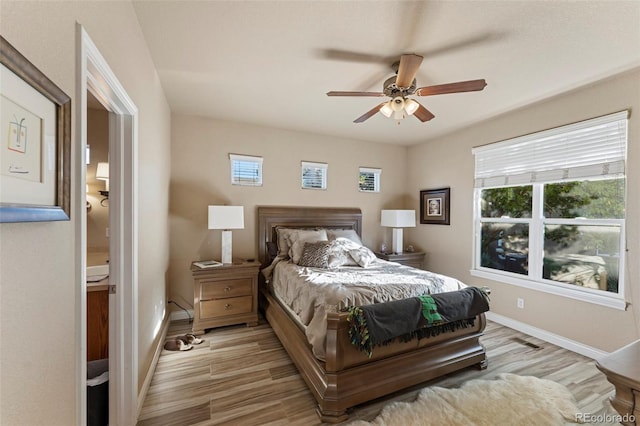 bedroom with ceiling fan and light hardwood / wood-style flooring