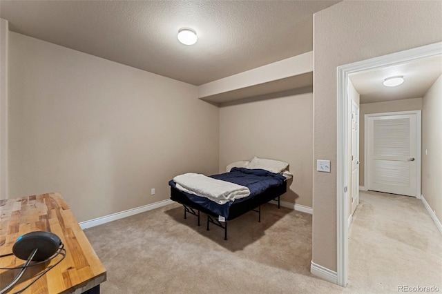 carpeted bedroom with a textured ceiling