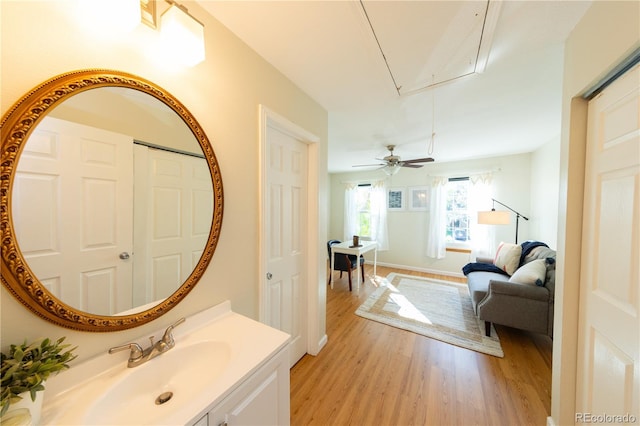 bathroom featuring vanity, wood-type flooring, and ceiling fan