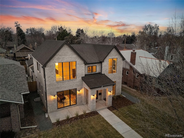 view of front of property with a yard