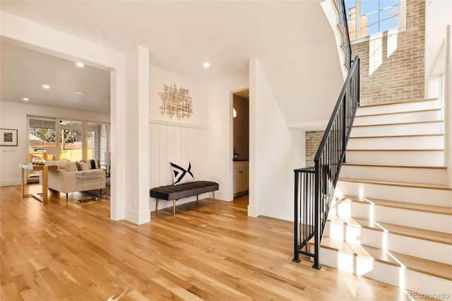 staircase featuring wood-type flooring