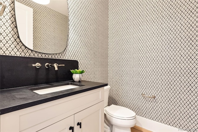 bathroom with vanity and toilet