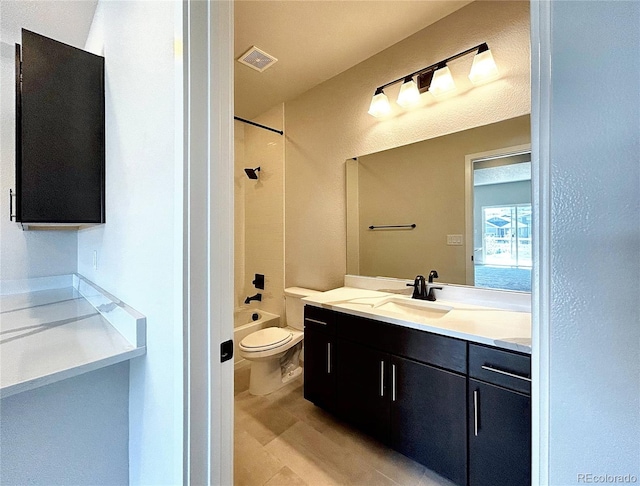 full bathroom featuring shower / bathtub combination, vanity, and toilet