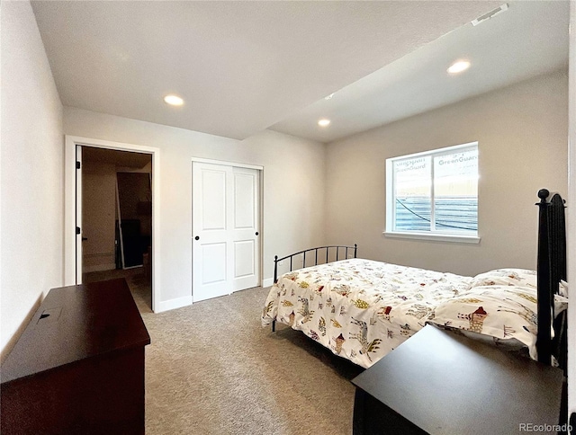 carpeted bedroom with a closet