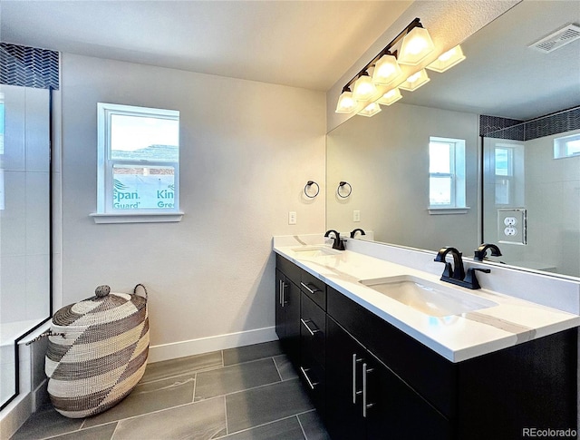 bathroom with vanity and plenty of natural light