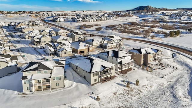 snowy aerial view with a mountain view