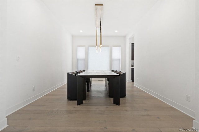 unfurnished dining area featuring wood-type flooring