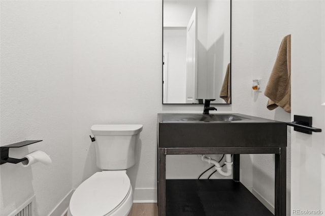 bathroom with sink and toilet