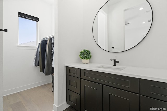 bathroom featuring hardwood / wood-style flooring and vanity