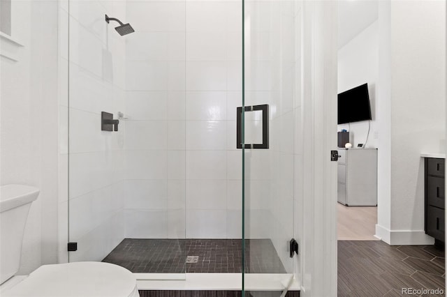 bathroom with toilet and walk in shower