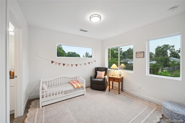 5242 Columbine Ln, Denver, CO 80221 - bedroom with baseboards, a crib, and carpet floors