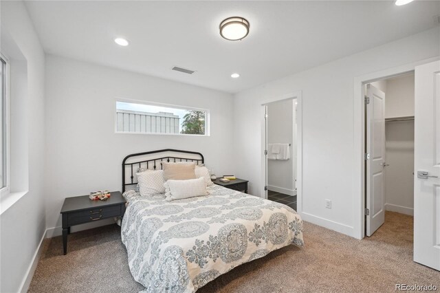 5242 Columbine Ln, Denver, CO 80221 - bedroom featuring carpet, recessed lighting, a walk in closet, and baseboards