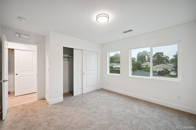 5242 Columbine Ln, Denver, CO 80221 - unfurnished bedroom featuring light carpet, baseboards, and a closet