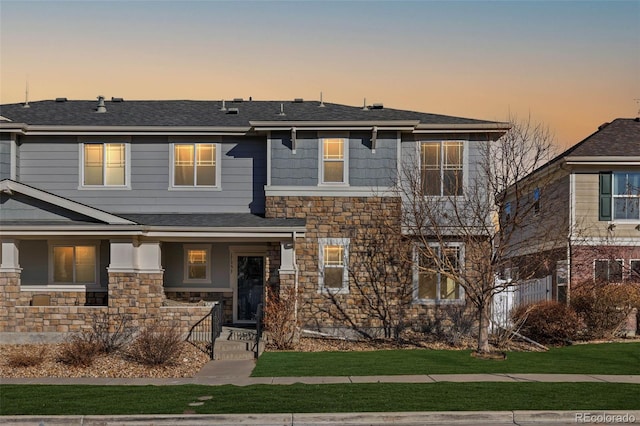 view of front of property with a lawn