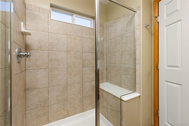 bathroom featuring tiled shower