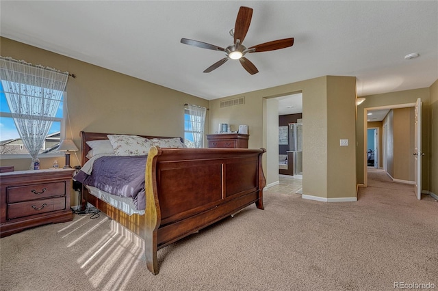 bedroom featuring baseboards, visible vents, a ceiling fan, and light colored carpet