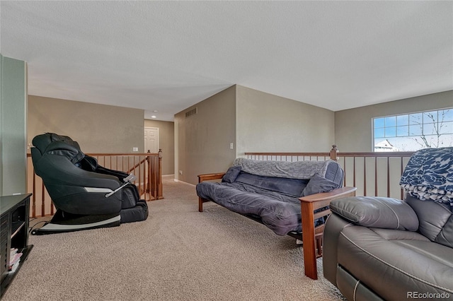 living room with visible vents, carpet flooring, a textured ceiling, and baseboards