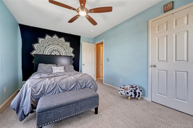 bedroom with carpet, ceiling fan, and baseboards