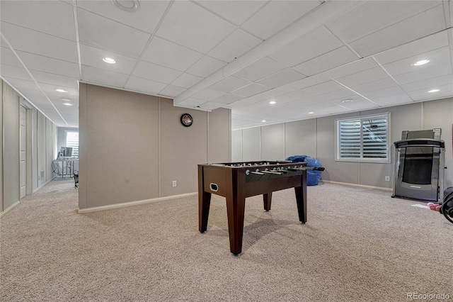 rec room with light carpet, a decorative wall, a paneled ceiling, and recessed lighting