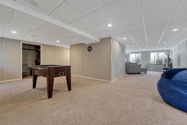 game room with a paneled ceiling, light colored carpet, and recessed lighting