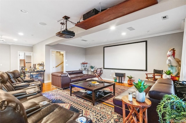 cinema featuring visible vents, crown molding, baseboards, recessed lighting, and wood finished floors