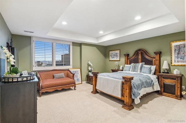 carpeted bedroom with recessed lighting, visible vents, a raised ceiling, and baseboards