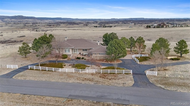 birds eye view of property with a rural view and a mountain view