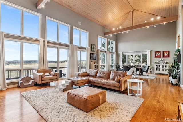 living room featuring light wood-style floors, high vaulted ceiling, wood ceiling, and track lighting