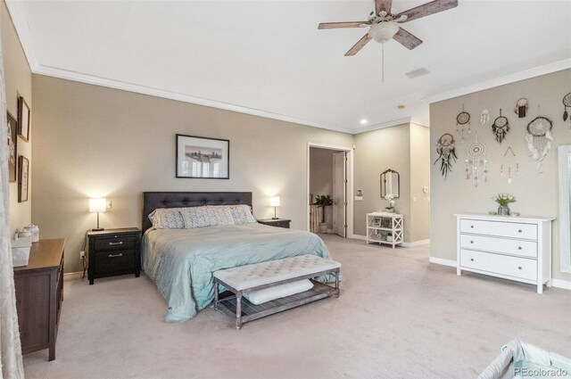 bedroom with visible vents, light carpet, baseboards, and ornamental molding