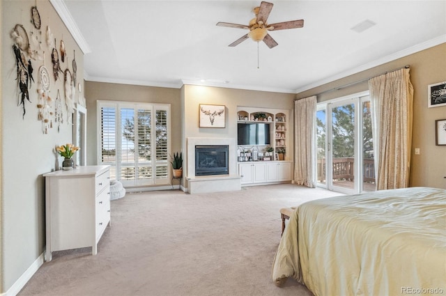 bedroom with a glass covered fireplace, crown molding, baseboards, light colored carpet, and access to exterior