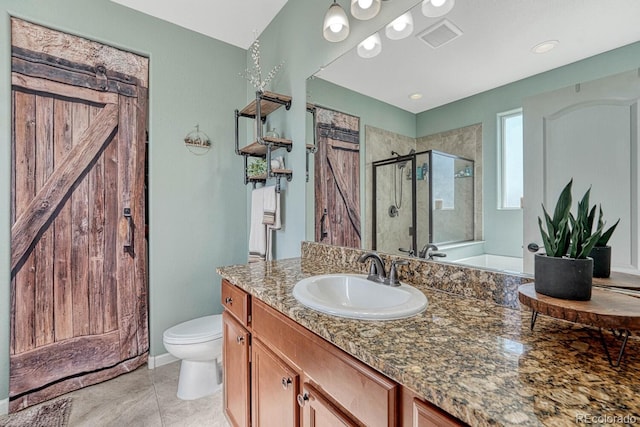 bathroom with an enclosed shower, vanity, toilet, and tile patterned flooring