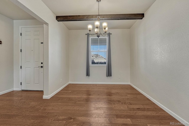 unfurnished dining area with a notable chandelier, baseboards, wood finished floors, and beamed ceiling