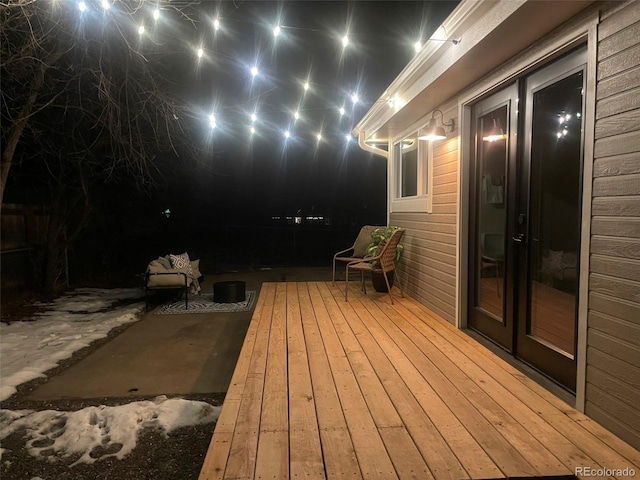 wooden terrace featuring a patio