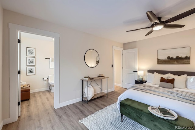 bedroom with ceiling fan, ensuite bath, and light hardwood / wood-style flooring