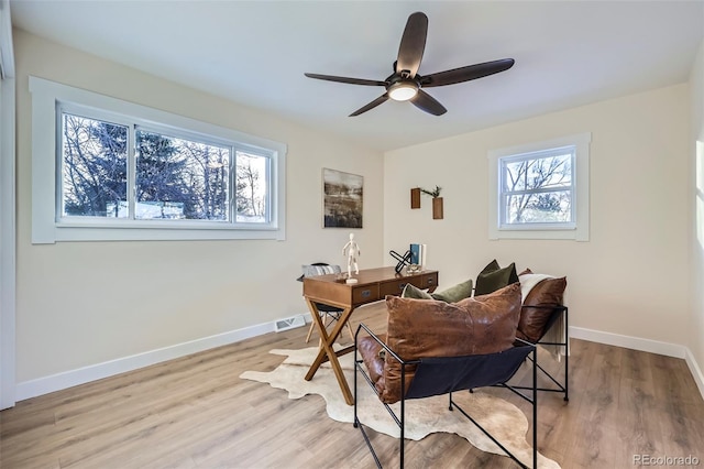 dining area with ceiling fan and light hardwood / wood-style floors