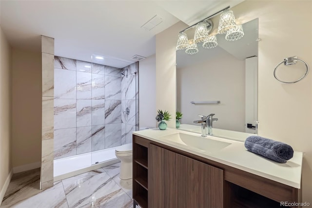 bathroom featuring vanity, a chandelier, toilet, and tiled shower