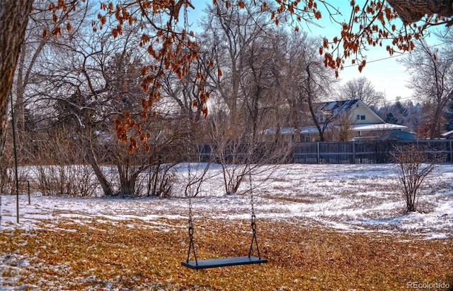 view of yard layered in snow