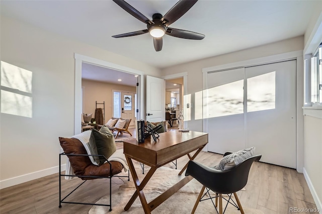 office area with ceiling fan and light wood-type flooring