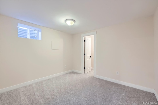 unfurnished room with light carpet