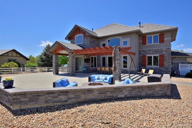 1315 W 141st Cir, Westminster, CO 80023 - rear view of property with stone siding, a tile roof, a pergola, a patio, and an outdoor living space with a fire pit