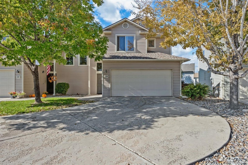 view of front of house featuring a garage and concrete driveway