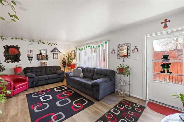 1112 W Mesa Ave Unit 1114, Pueblo, CO 81004 - living room featuring healthy amount of natural light and wood finished floors
