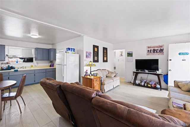 1112 W Mesa Ave Unit 1114, Pueblo, CO 81004 - living area featuring light wood finished floors